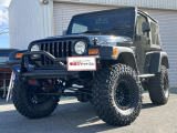 【中古車情報】クライスラージープ ラングラー スポーツ ソフトトップ 4WD ZEAL足廻り 整備バッチリ 5速! の中古車詳細（走行距離：7.6万km、カラー：ブラック、販売地域：兵庫県加古川市東神吉町天下原）