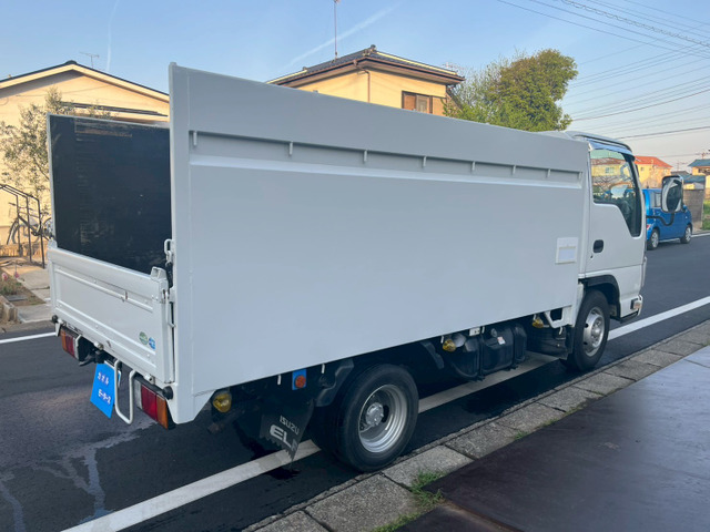 いすゞ エルフ 10尺平ボディ高あおり1.5t積車検付き の中古車