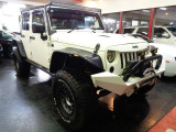 ジープラングラーアンリミテッド3.8V6モデル4WD&黒幌TOPオーバーフェンダーリフトUP&ステンマフラーXDアルミブロックタイヤ電動ステップ他装備充実車が入庫しました