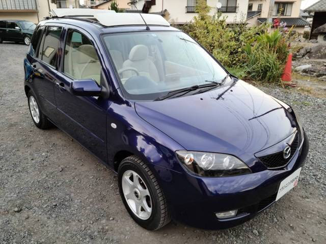 中古車 マツダ デミオ 1 3 コージー ホワイトキャンバストップ装着車 走行5万kmhidスポルト用ヘッドライトetc の中古車詳細 50 000km ダークブルー 大分県 26万円 中古車情報 中古車検索なら 車選びドットコム 車選び Com