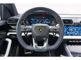 Multi-function steering wheel with perforated leather inserts