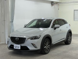 お目当てのCX-3は旧国道1号線沿い、静清BP 長崎ICを降りて5分。隣接の清水吉川店と並び奥のユーセレクト静岡店にて展示中です。 レンガ色のマンションの真向かいの駐車場完備の中古車専門店舗です。