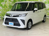 立体感のあるフロントマスクと伸びやかな車体側面が目を引きます。白いボディに黒いグリルが映え、洗練された印象と親しみやすさを感じる佇まいです。