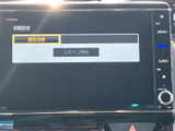テレビ機能の初期設定画面が表示されており、地域を選んでスキャンを進める案内が確認できます。設定後は停車中に映像やテレビを視聴でき、休憩時間にもお楽しみいただけます。